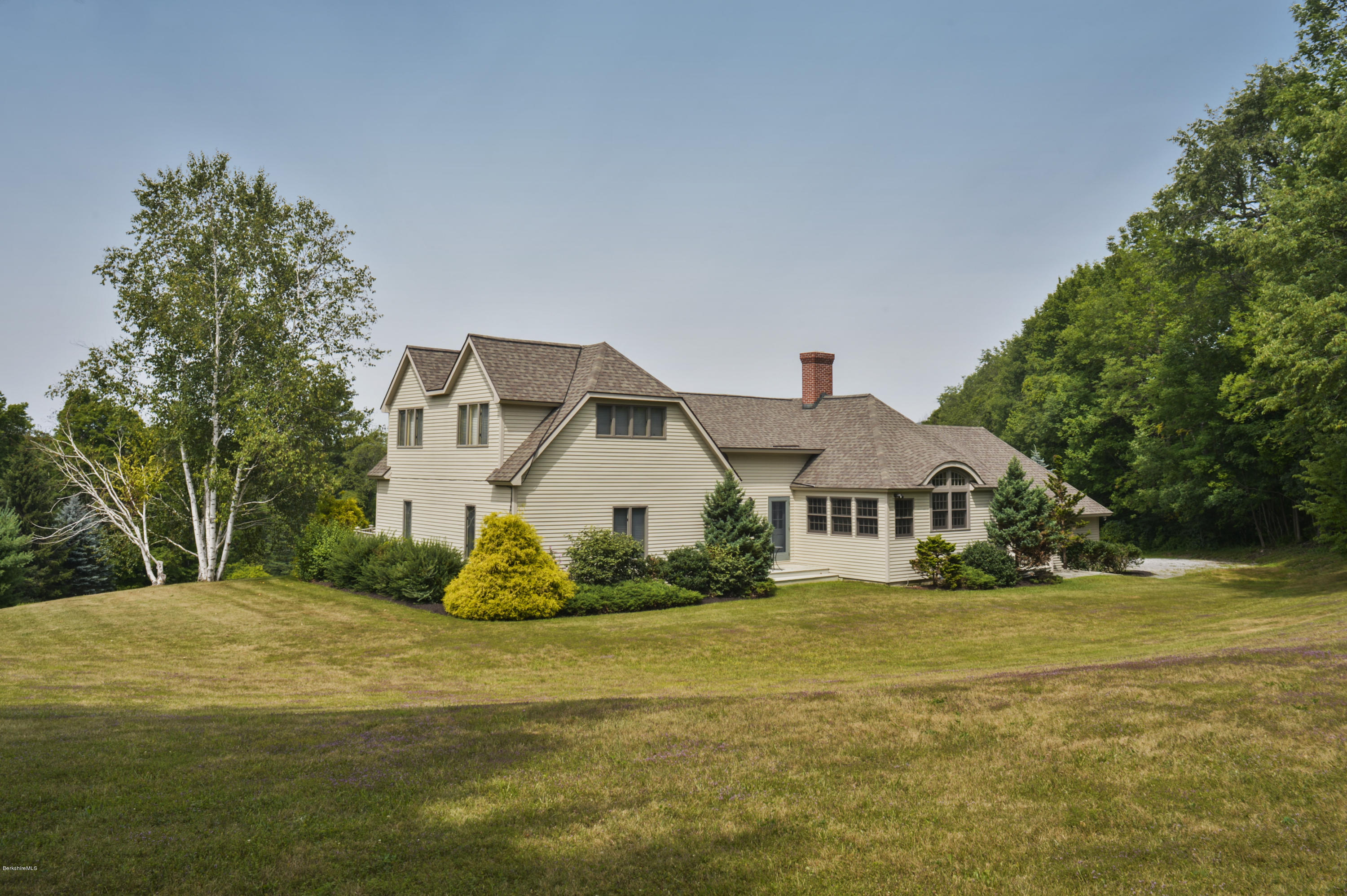 22 Tyringham Road Monterey, MA 01245 - Photo 2 of 24 a front view of a house with a yard