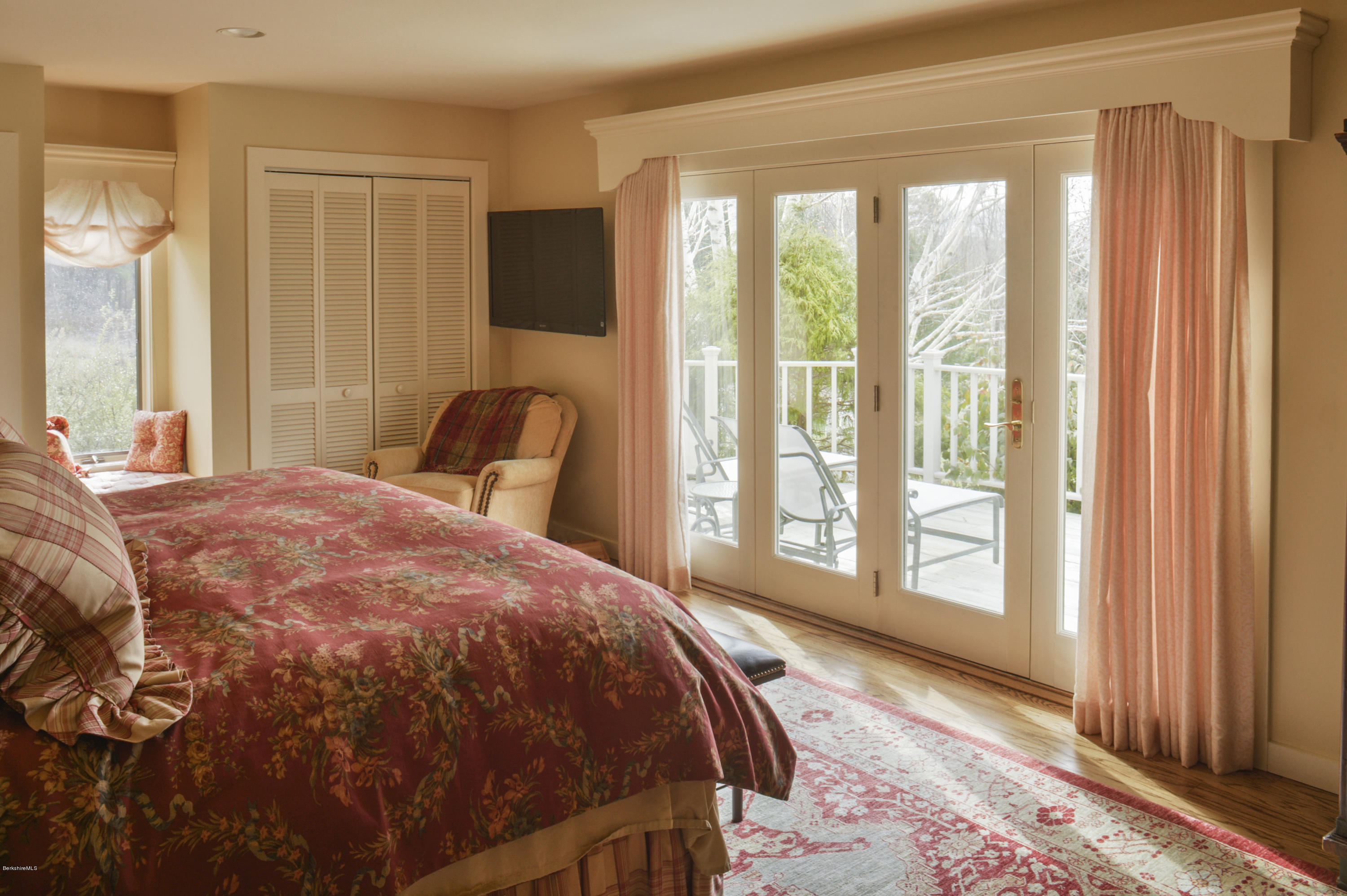 22 Tyringham Road Monterey, MA 01245 - Photo 14 of 24 a bedroom with a bed and large windows