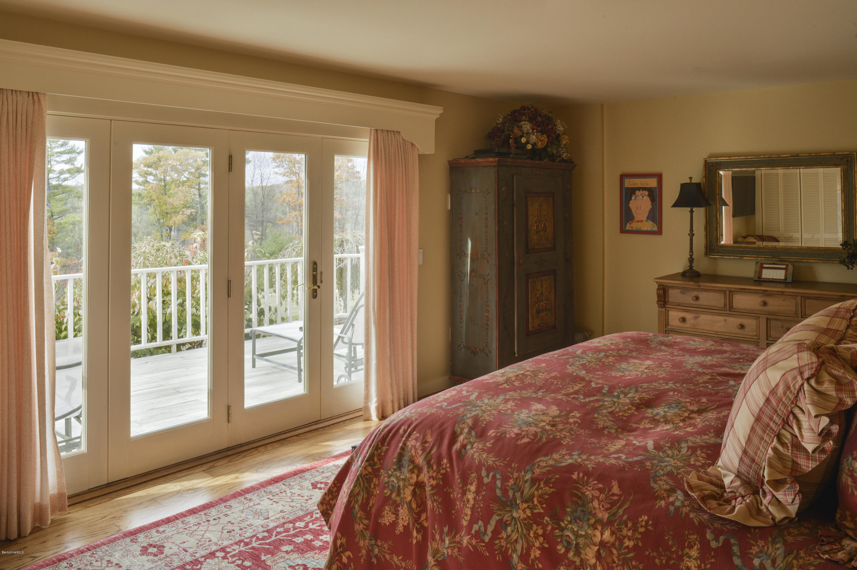 22 Tyringham Road Monterey, MA 01245 - Photo 15 of 24 a bedroom with a bed and wooden floor