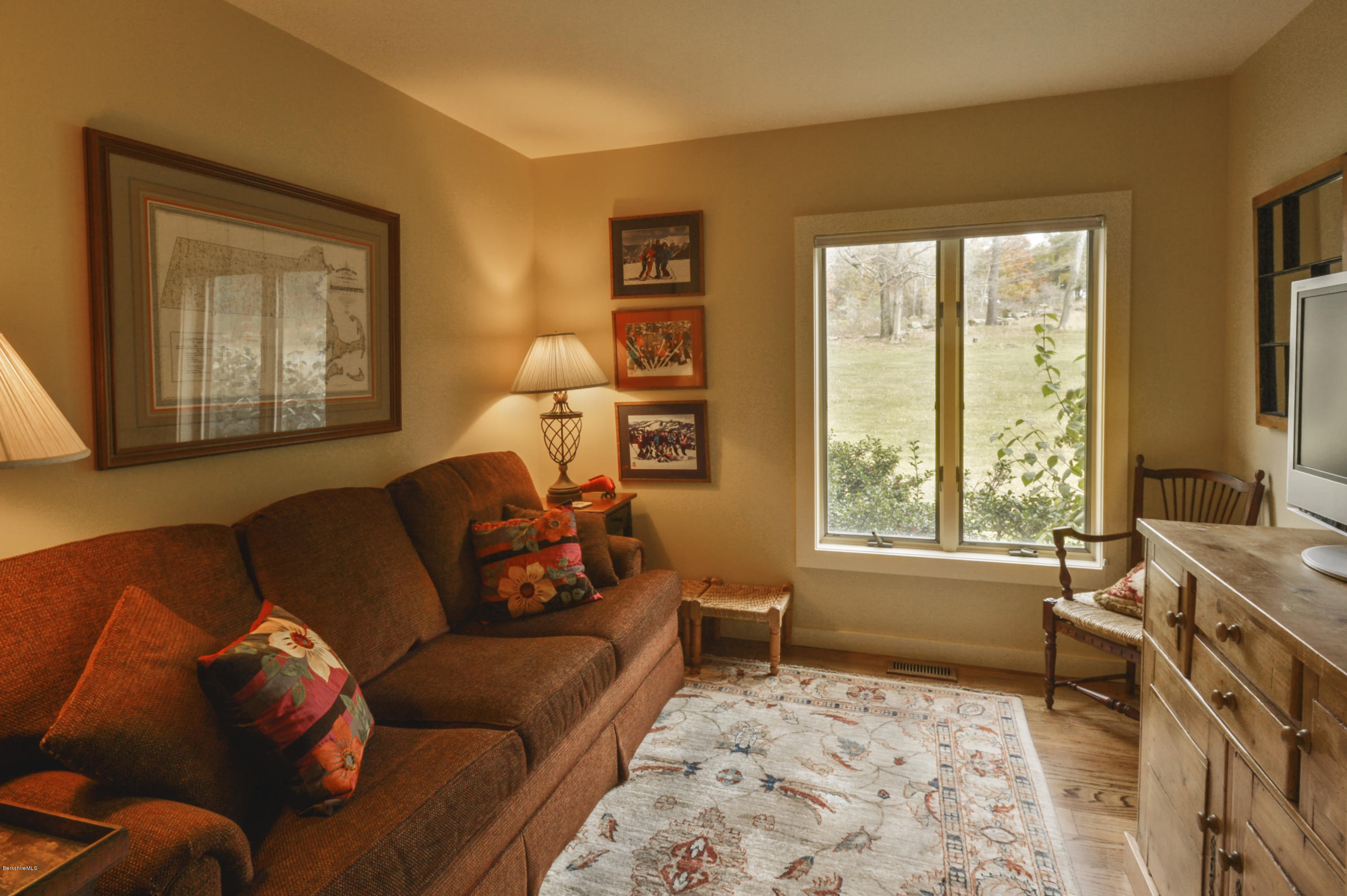 22 Tyringham Road Monterey, MA 01245 - Photo 17 of 24 a living room with furniture and a window