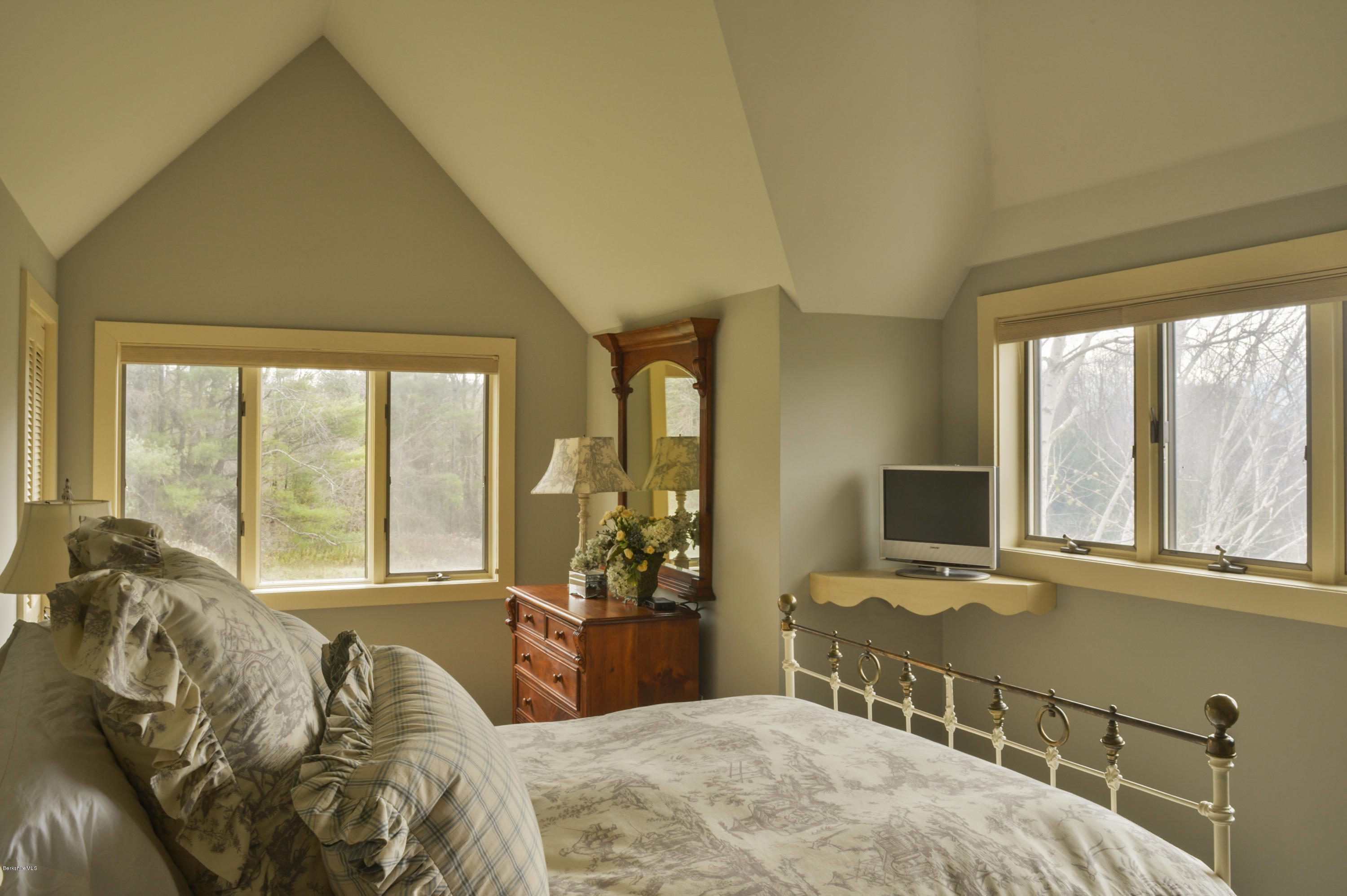 22 Tyringham Road Monterey, MA 01245 - Photo 19 of 24 a bedroom with a bed and large windows