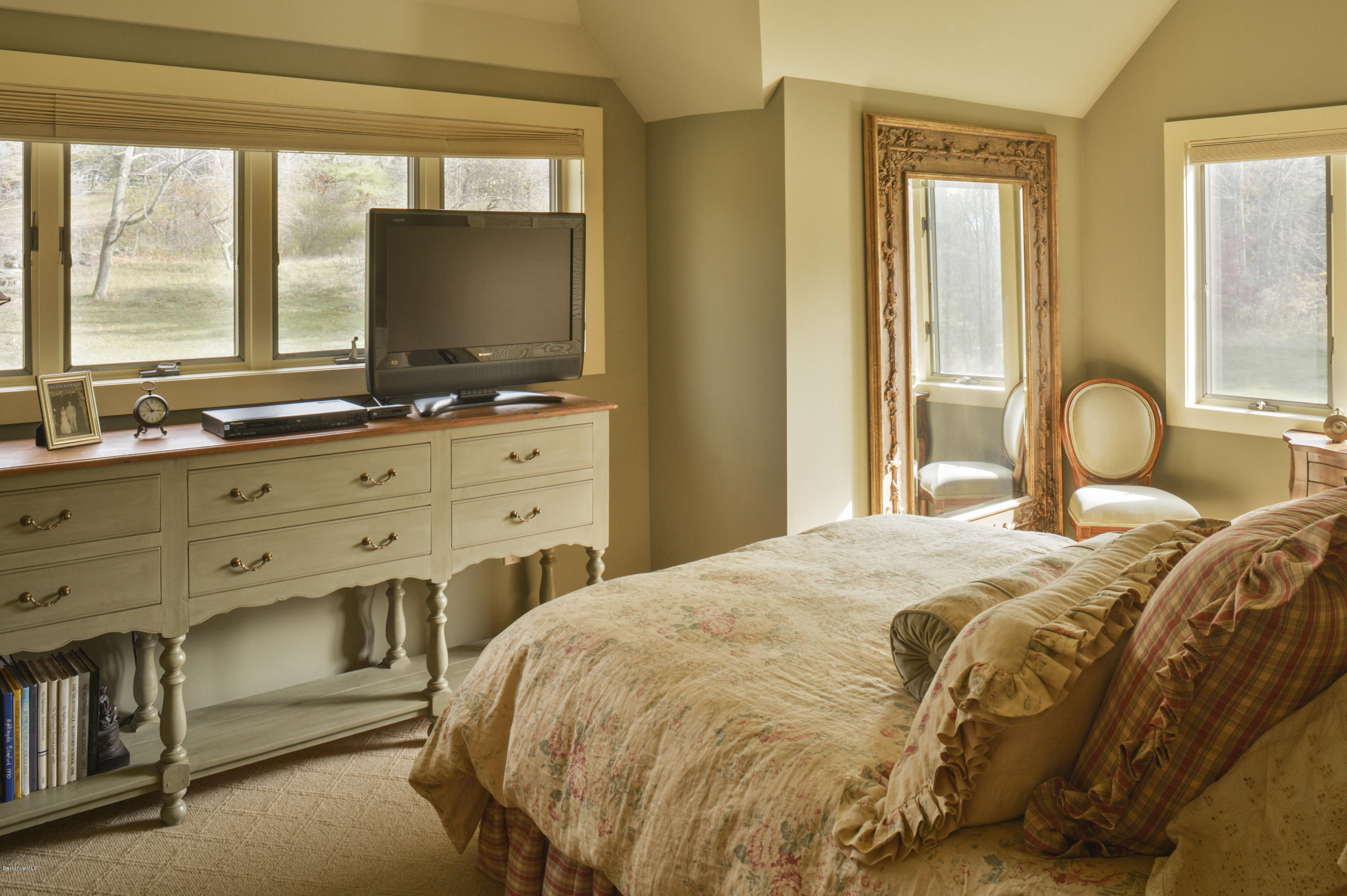 22 Tyringham Road Monterey, MA 01245 - Photo 20 of 24 a bedroom with a bed and large windows
