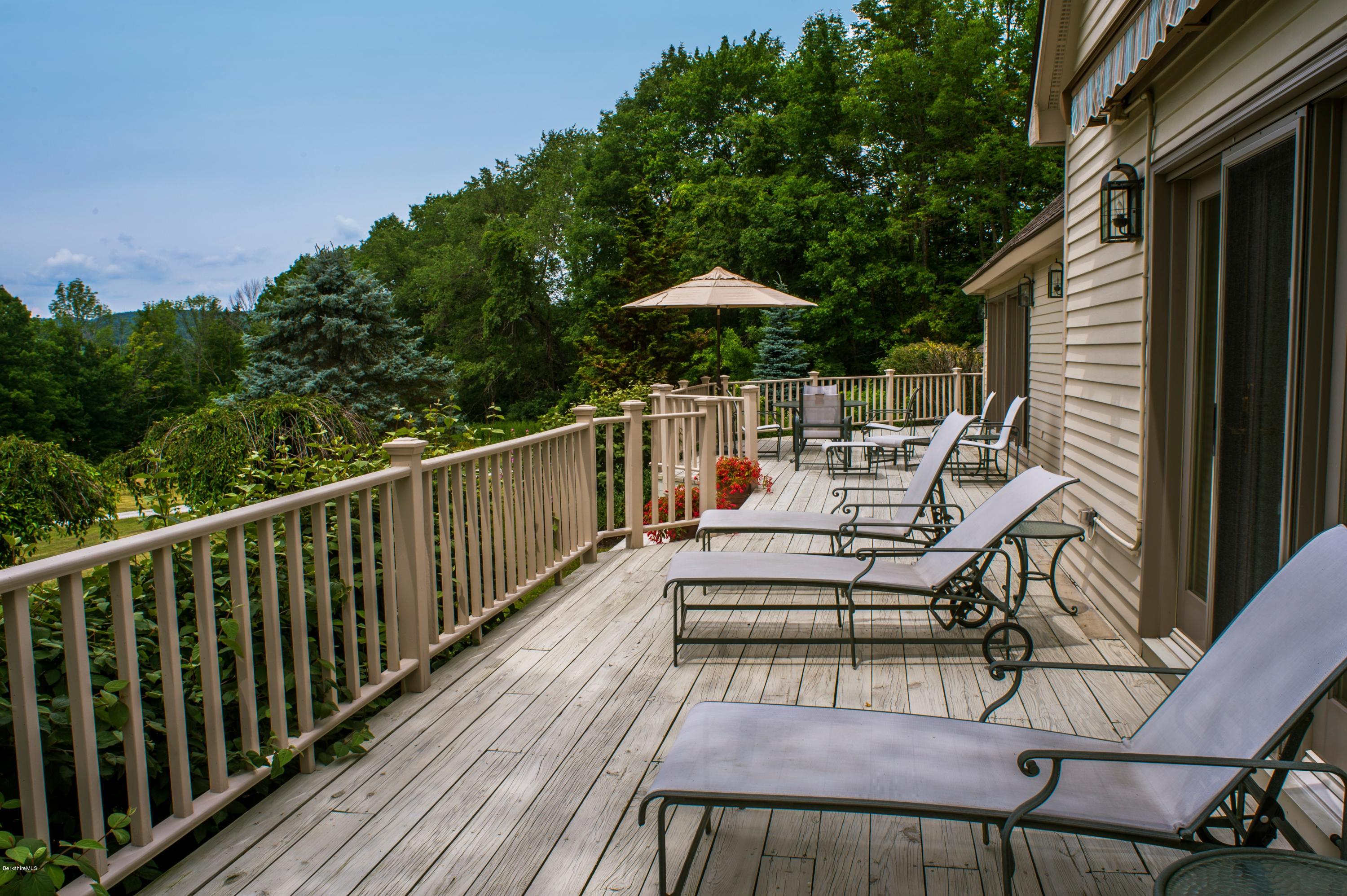 22 Tyringham Road Monterey, MA 01245 - Photo 21 of 24 a view of balcony with wooden floor and outdoor seating