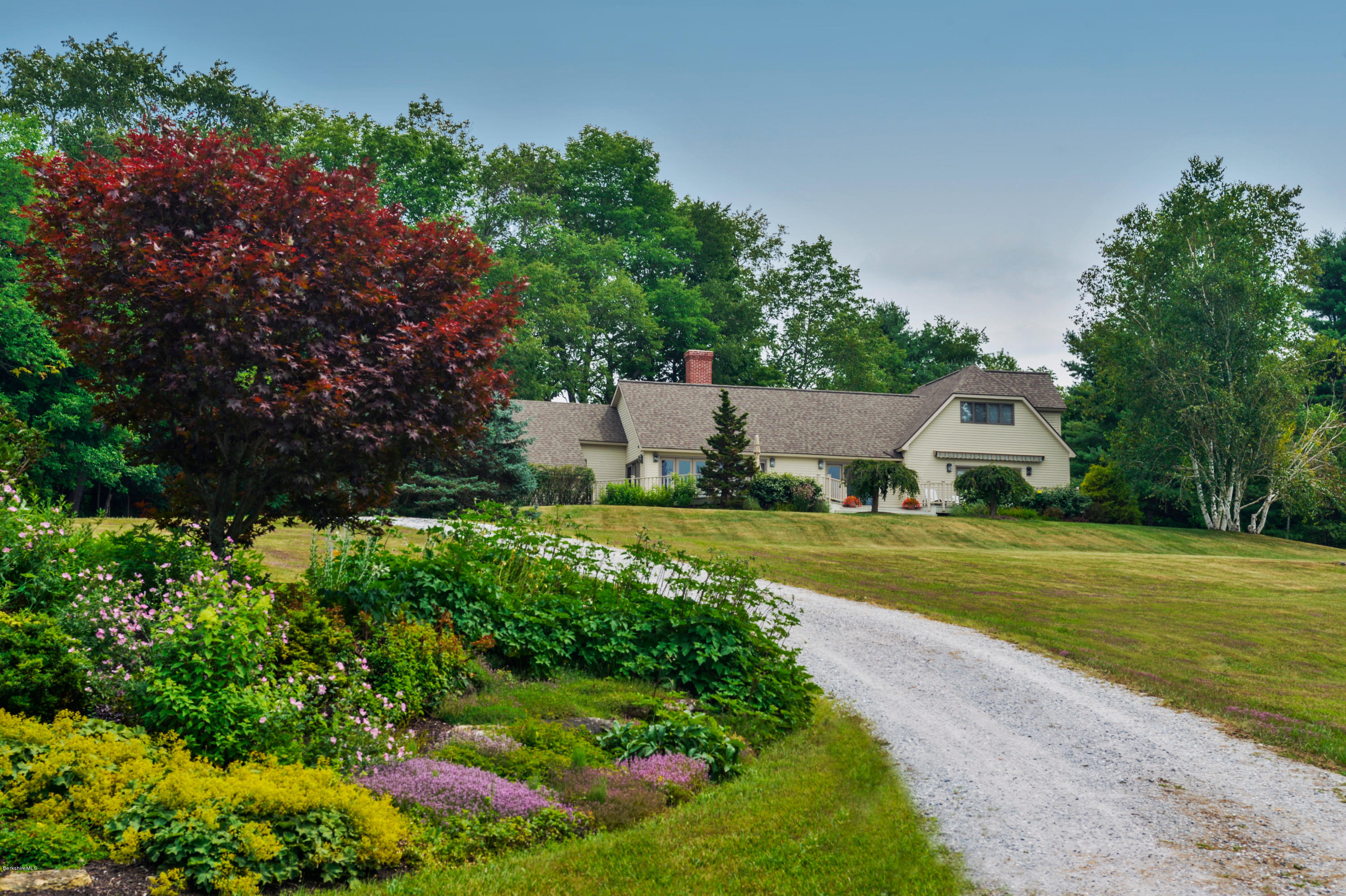22 Tyringham Road Monterey, MA 01245 - Photo 24 of 24 a view of a house with a big yard and large trees