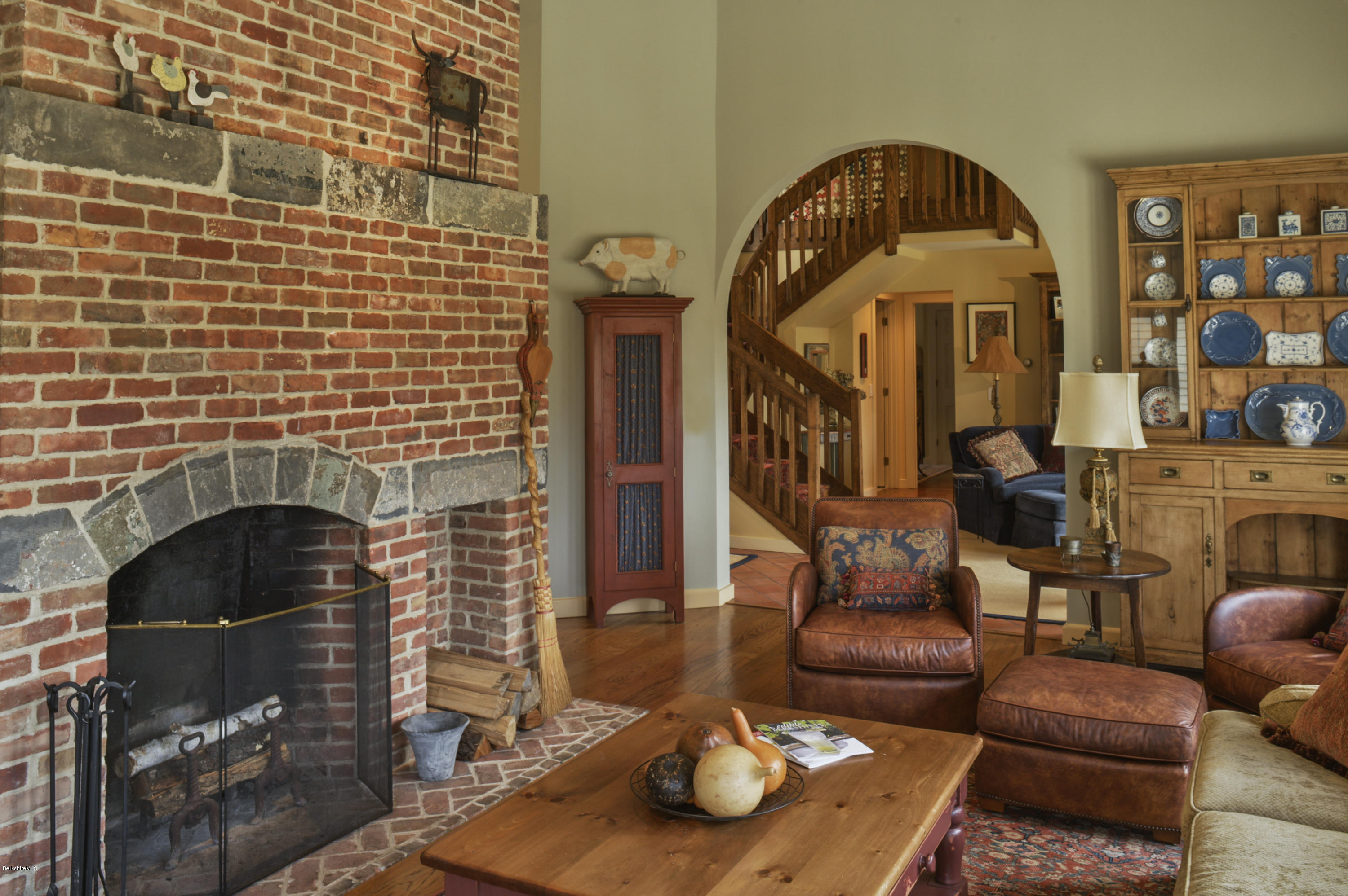 22 Tyringham Road Monterey, MA 01245 - Photo 5 of 24 a living room with furniture a fireplace and a dining table