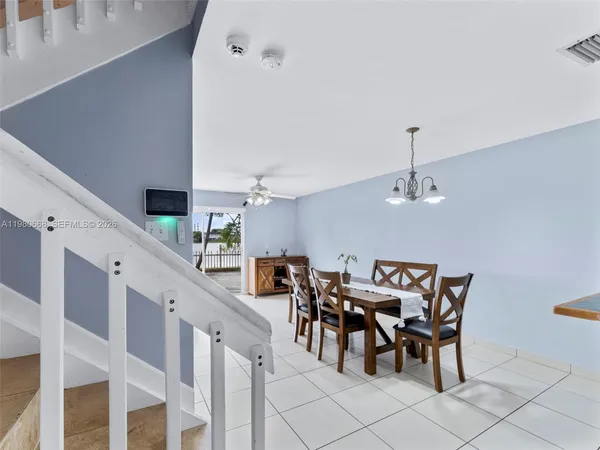 a view of a dining room and hall with furniture