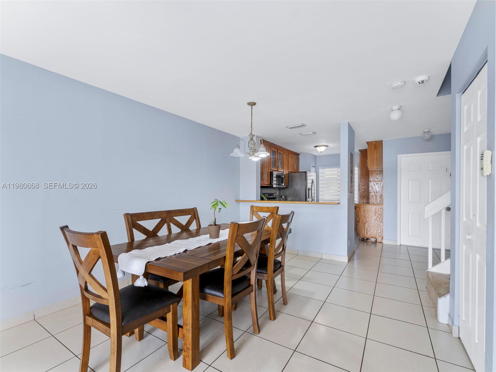 17337 Southwest 140th Court Miami, FL 33177 - Photo 15 of 41 a view of a dining room with furniture