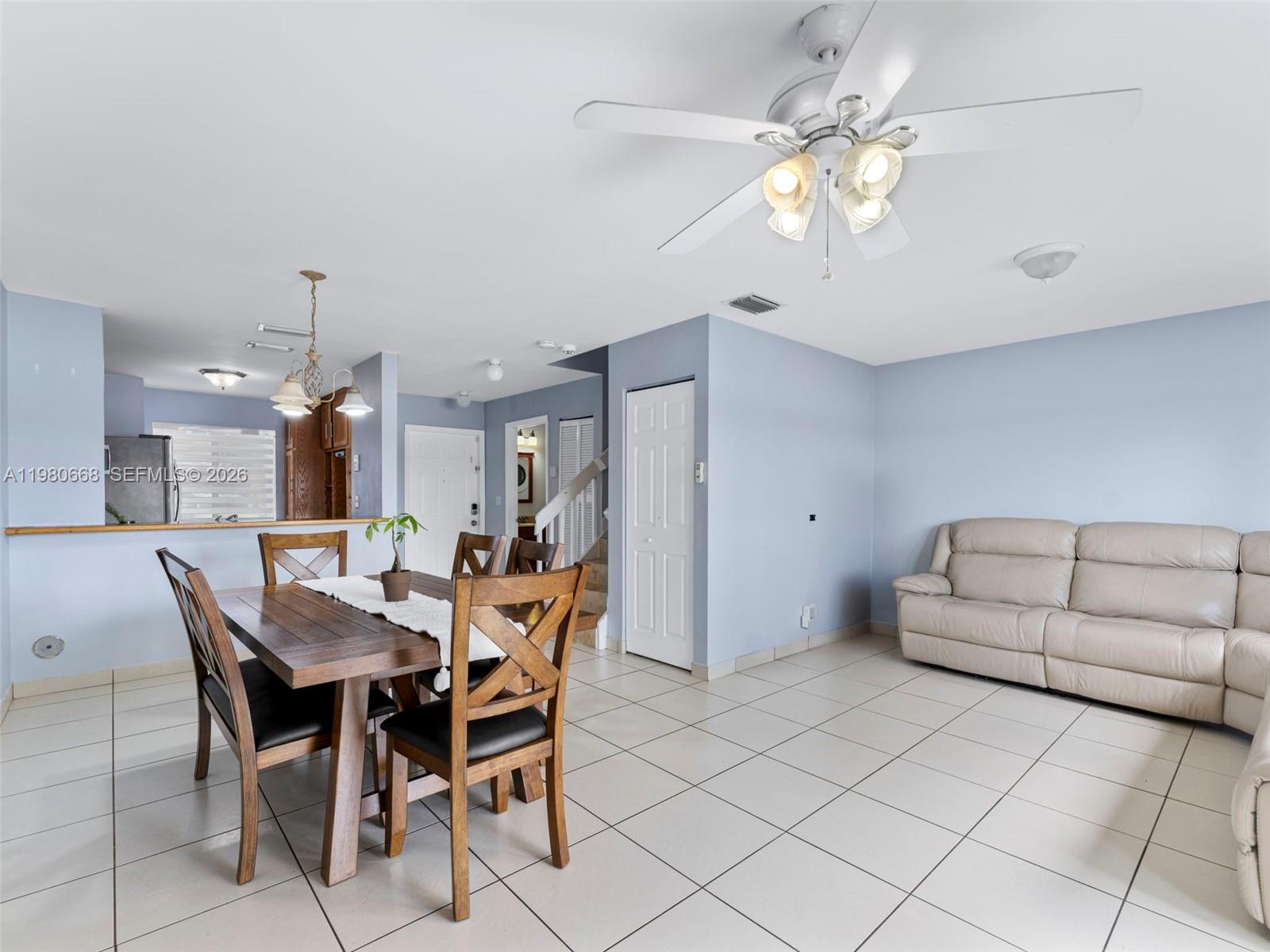17337 Southwest 140th Court Miami, FL 33177 - Photo 17 of 41 a view of a dining room with furniture and chandelier