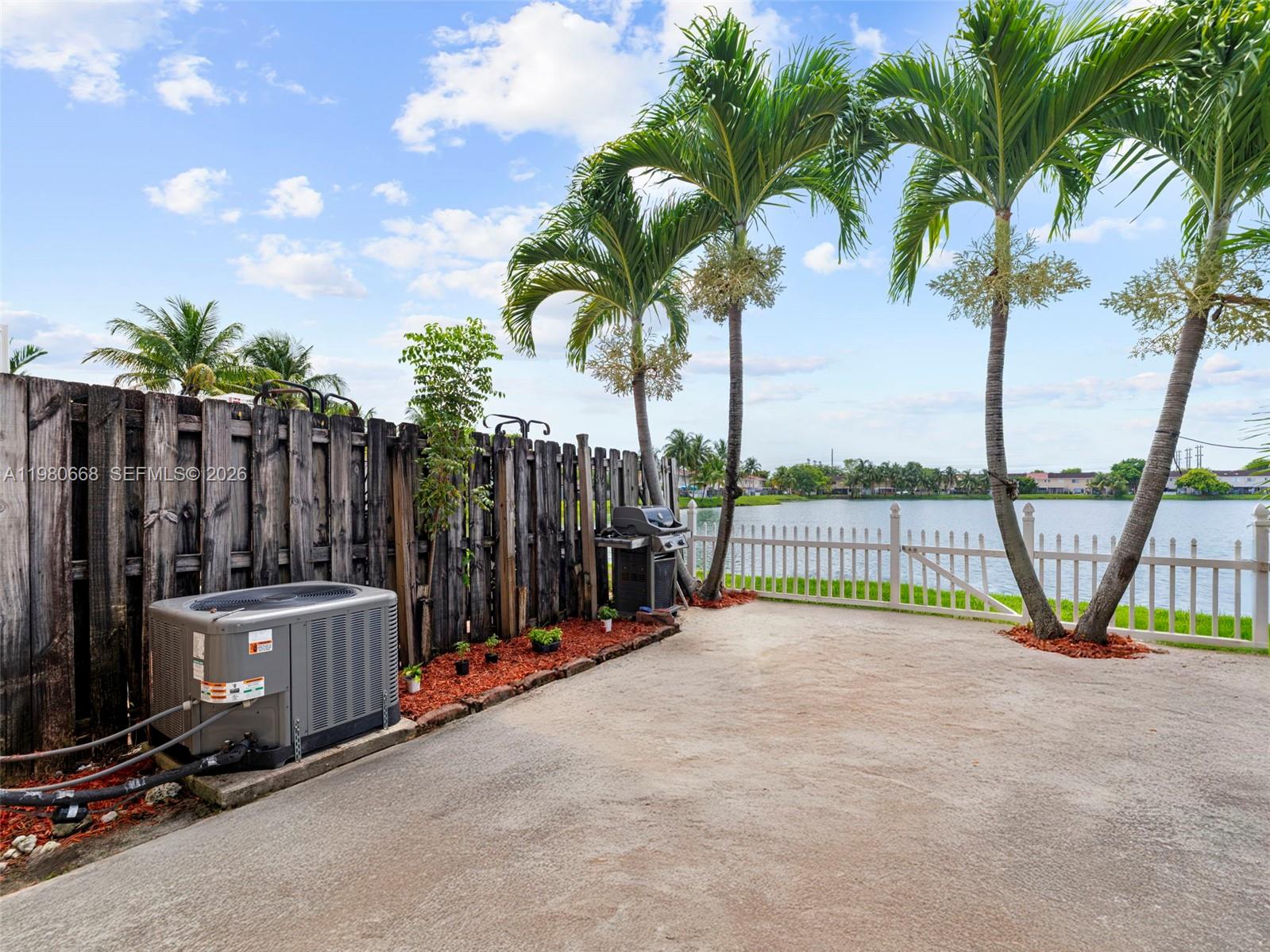 17337 Southwest 140th Court Miami, FL 33177 - Photo 21 of 41 a view of a garden with wooden fence