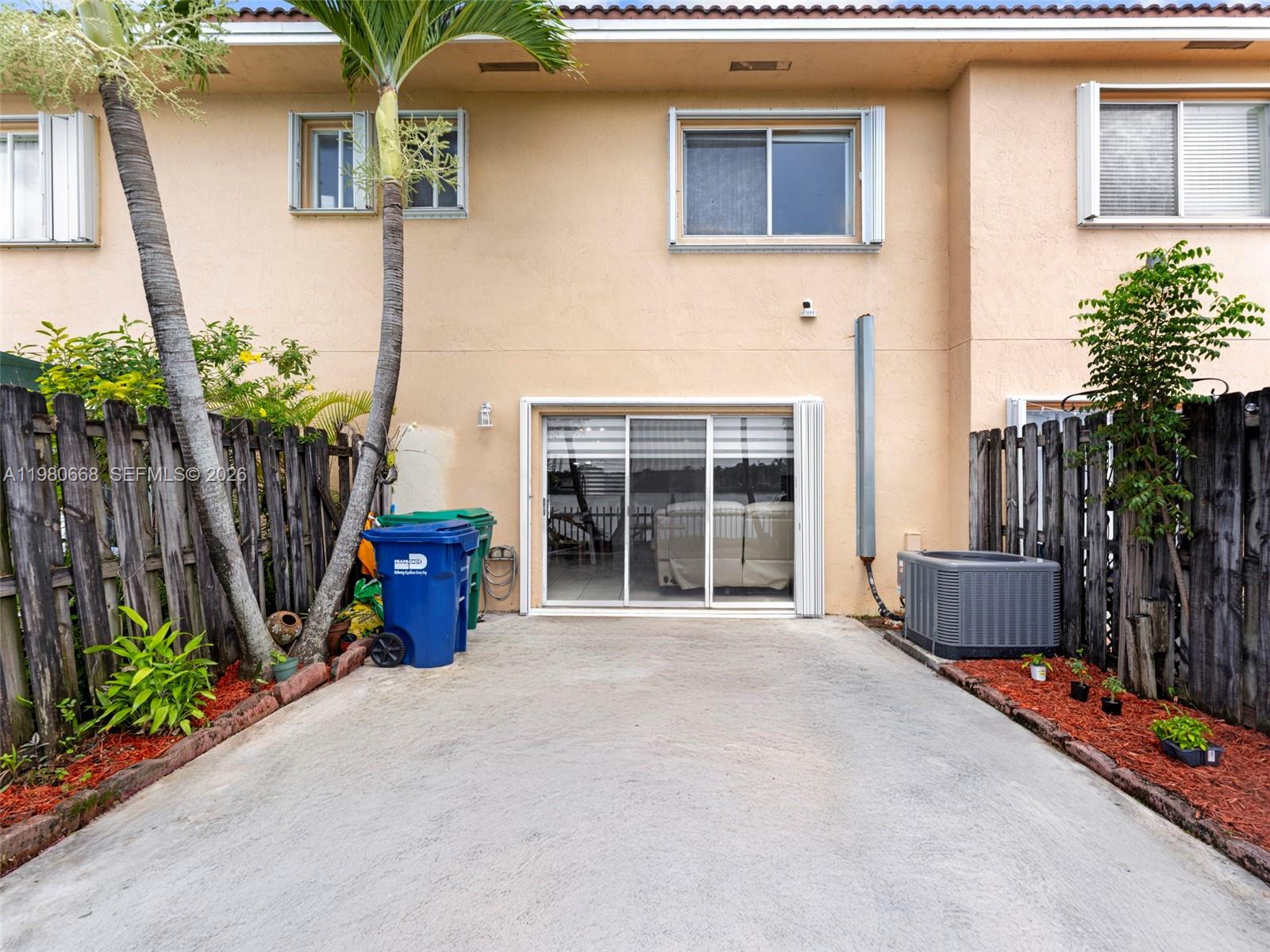 17337 Southwest 140th Court Miami, FL 33177 - Photo 22 of 41 a front view of a house with a yard