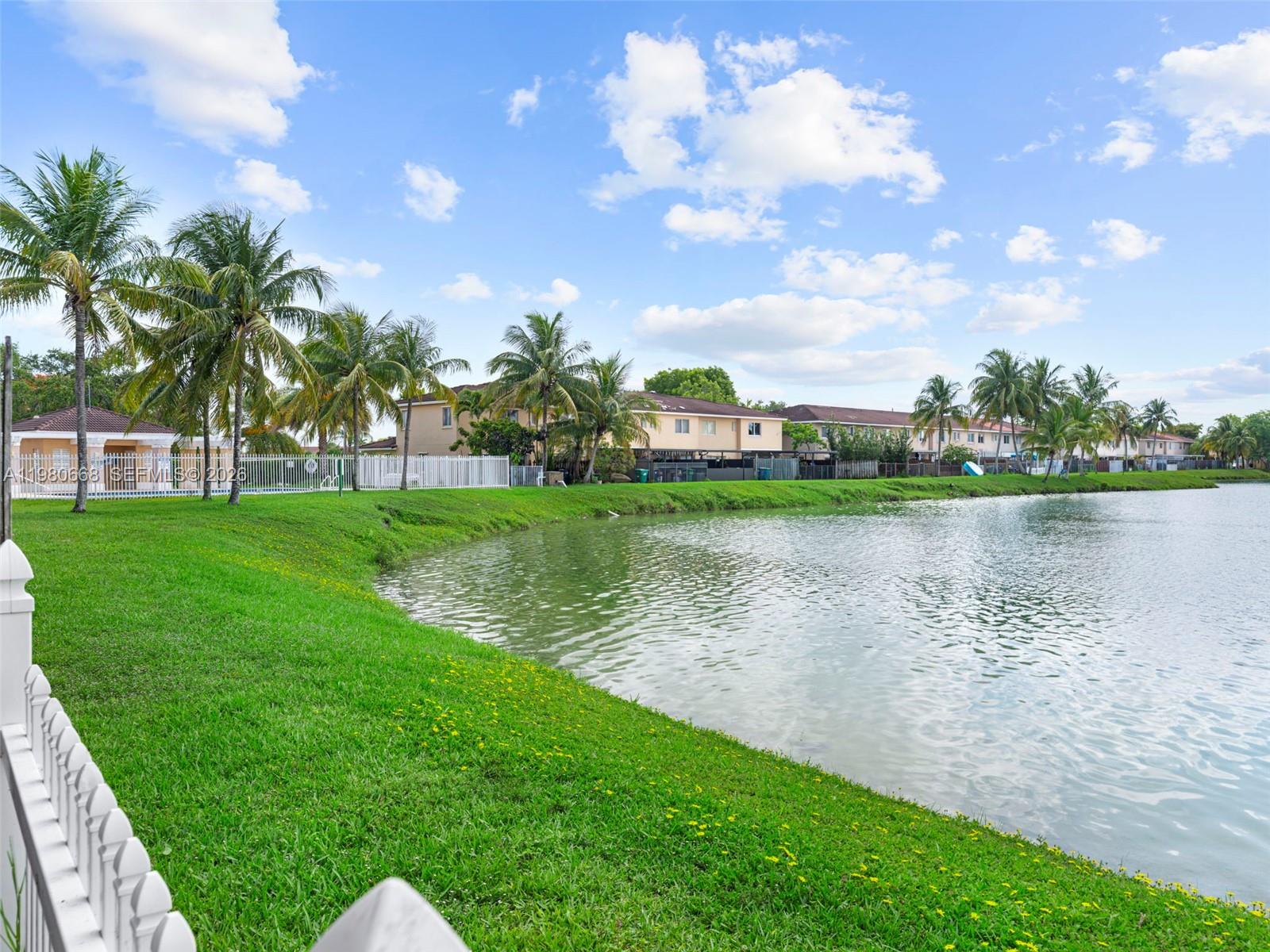 17337 Southwest 140th Court Miami, FL 33177 - Photo 23 of 41 a view of a lake with a big yard