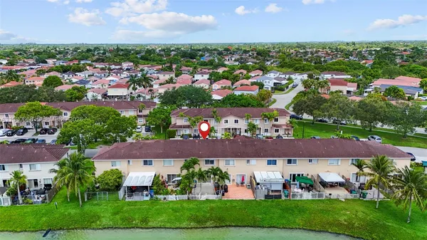 a green field with river in front of it