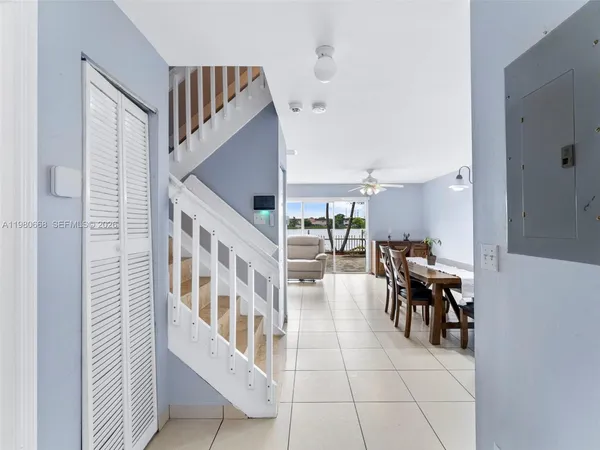 a view of entryway and hall with dining room