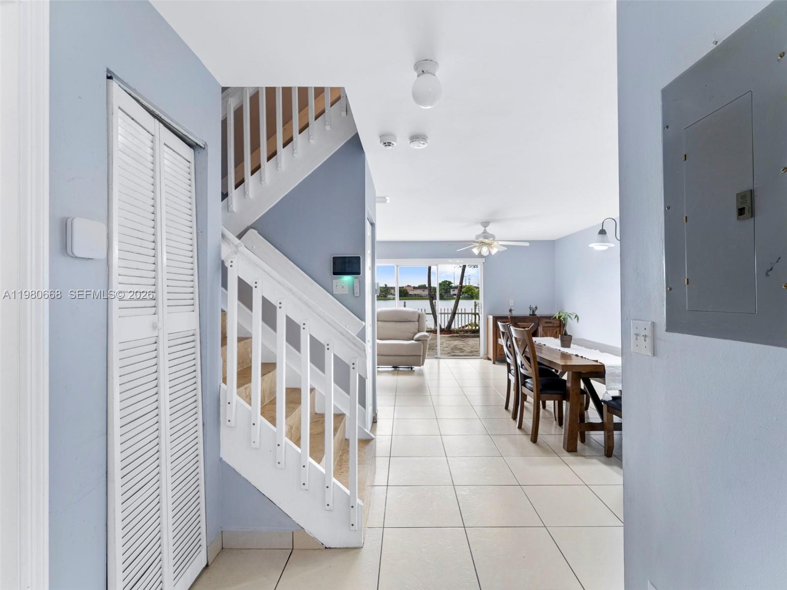 17337 Southwest 140th Court Miami, FL 33177 - Photo 5 of 41 a view of entryway and hall with dining room