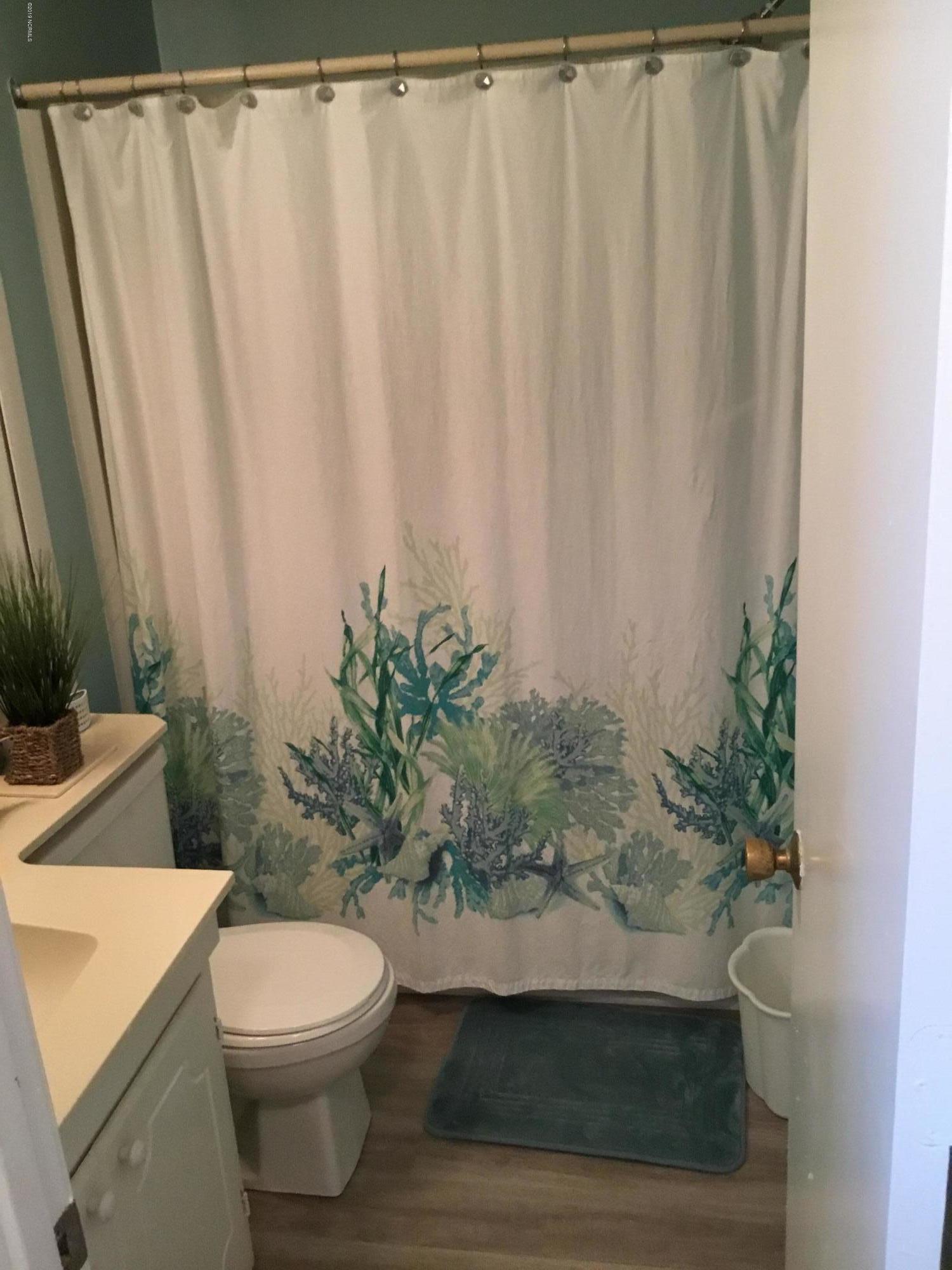 301 Commerce Way, Unit 241 Atlantic Beach, NC 28512 - Photo 6 of 12 View into hall full bath between bedrooms.