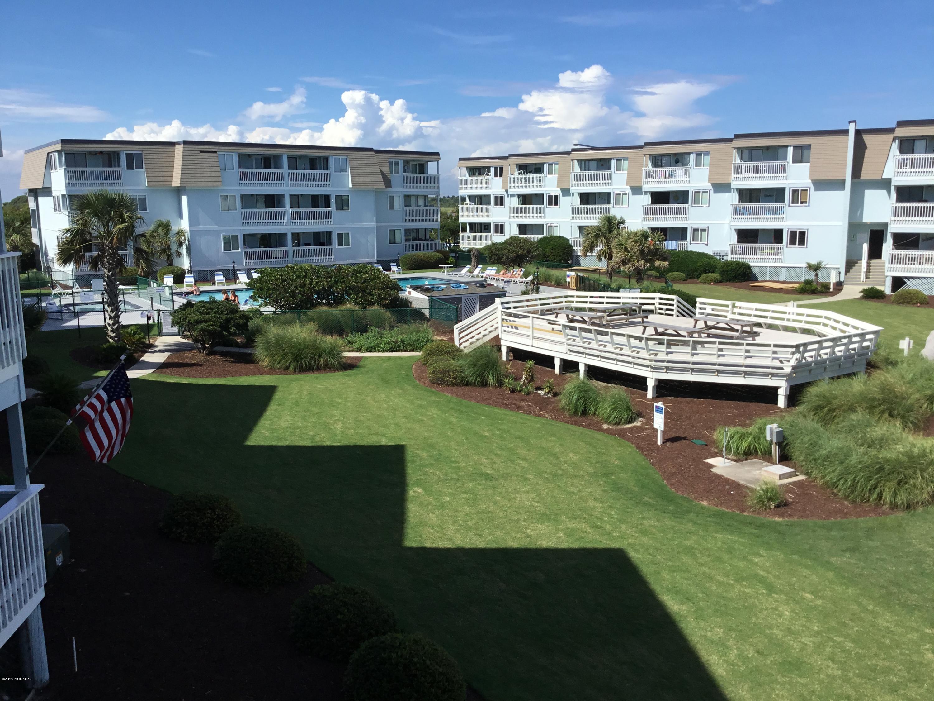 301 Commerce Way, Unit 241 Atlantic Beach, NC 28512 - Photo 8 of 12 View from balcony looking toward pool and picnic area.