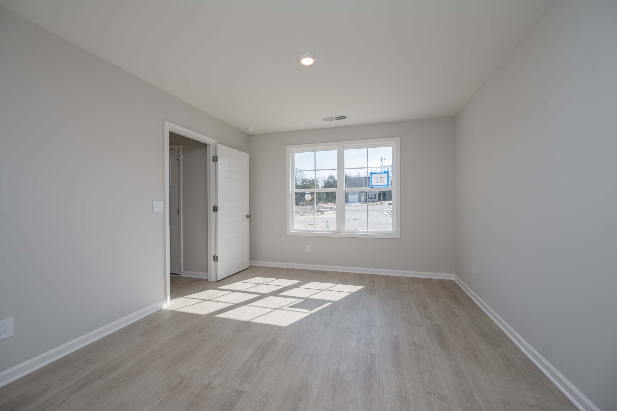 1313 Lakewalk Drive Antioch, TN 37013 - Photo 19 of 28 an empty room with wooden floor and windows