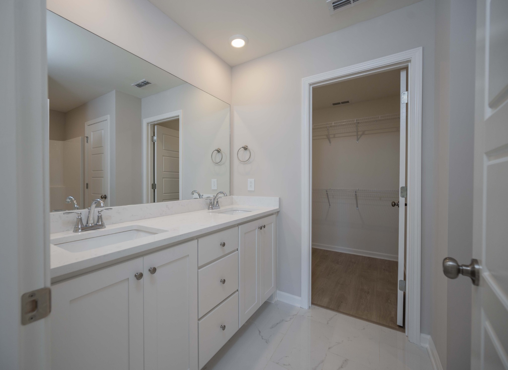 1313 Lakewalk Drive Antioch, TN 37013 - Photo 20 of 28 a bathroom with a double vanity sink and mirror