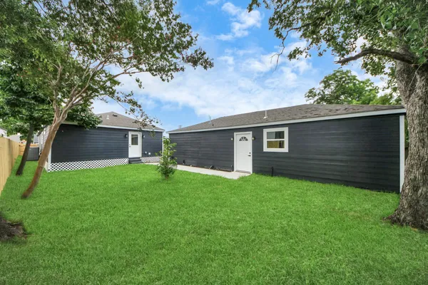 a backyard of a house with lots of green space