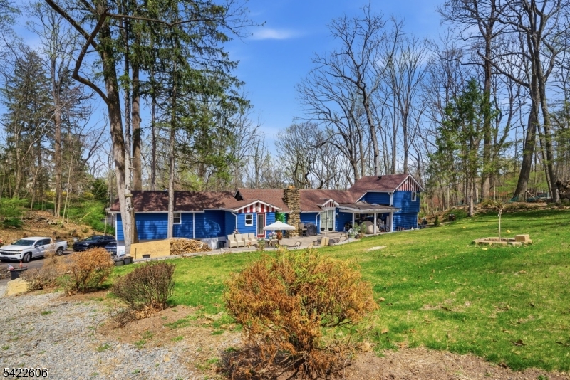 399 Springbrook Trail Sparta, NJ 07871 - Photo 22 of 27 a view of a yard with plants and trees