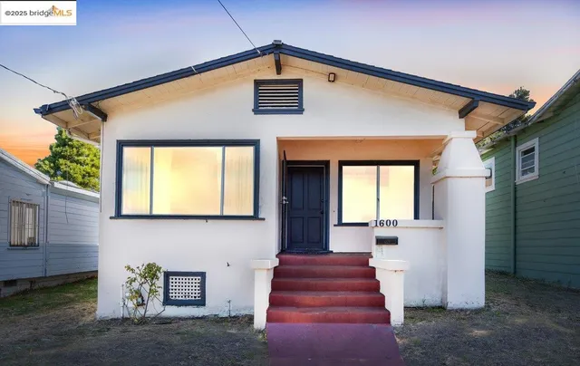 a view of a brick house with a large windows