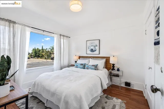 a bedroom with a bed and a window