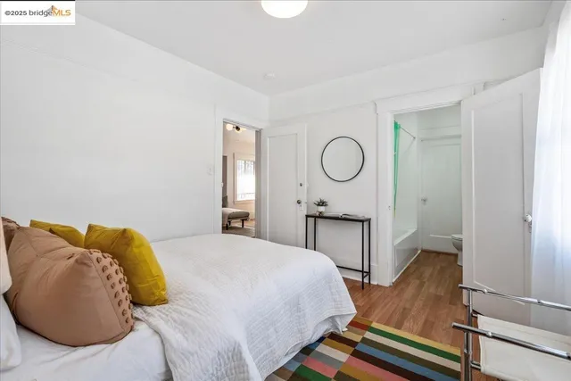 a bedroom with a bed and dresser