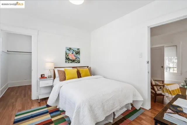 a bed room with a bed and wooden floor