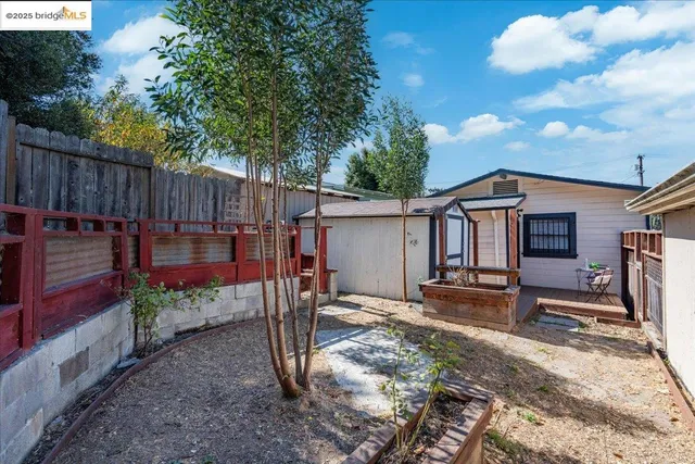 a backyard of a house with barbeque oven fire pit and outdoor seating