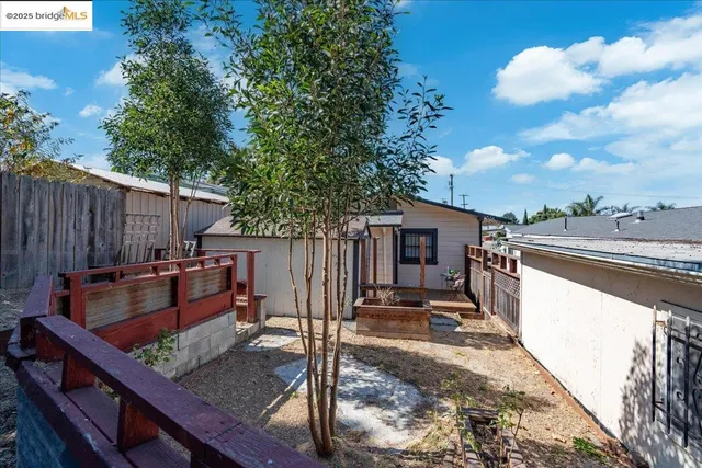 a view of a terrace with wooden floor and fence