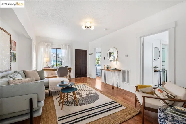 a living room with furniture and a table