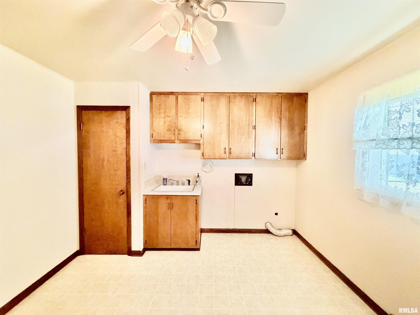 540 Meadowbrook Lane Centralia, IL 62801 - Photo 12 of 14 a kitchen with a refrigerator a stove top oven a sink and dishwasher with wooden floor