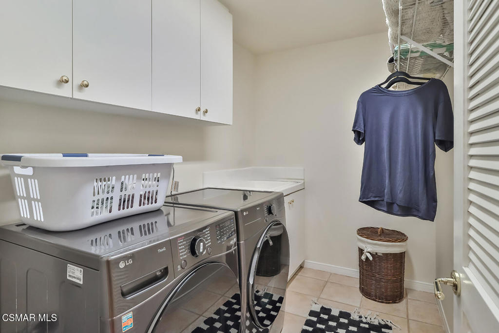 6291 Deerbrook Road Oak Park, CA 91377 - Photo 11 of 29 a kitchen with stainless steel appliances granite countertop a stove and a cabinets