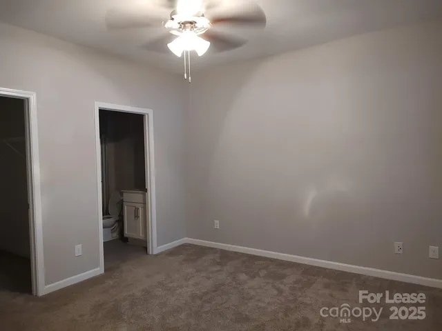 an empty room with a bathroom