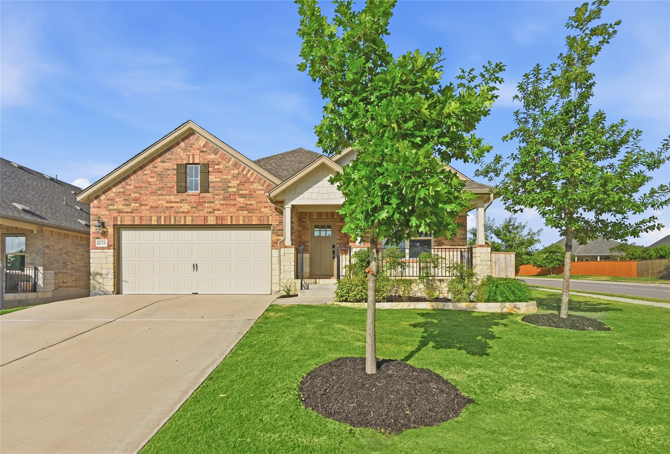 426 Cold Riv Run Kyle, TX 78640 - Photo 5 of 34 A well-maintained lawn welcomes you to this attractive brick and stone facade home.