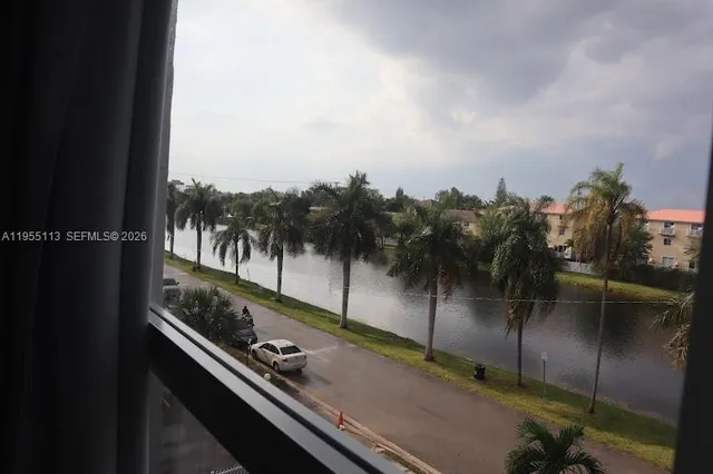 a view of balcony with two potted plants