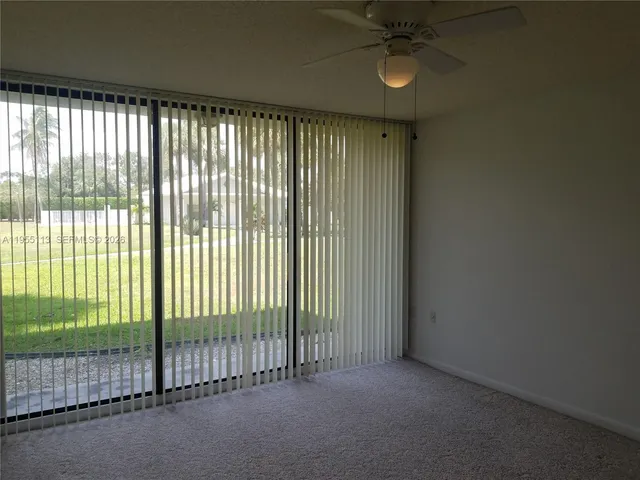 a view of a room with floor to ceiling windows