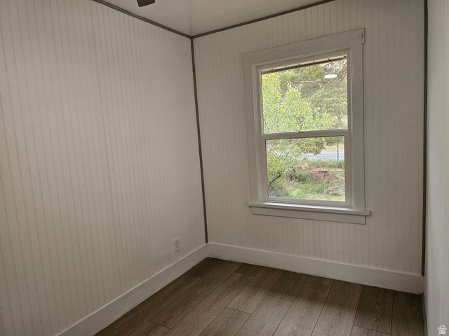 744 Royal Street Helper, UT 84526 - Photo 18 of 33 Empty room with baseboards and hardwood / wood-style floors