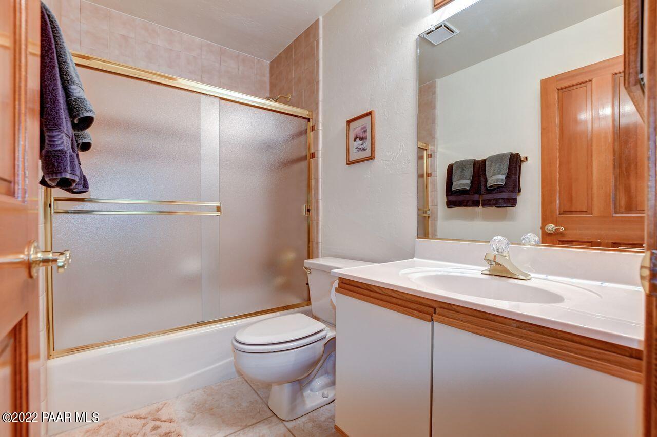 1219 Timber Point North Prescott, AZ 86303 - Photo 21 of 33 a bathroom with a sink a toilet and shower