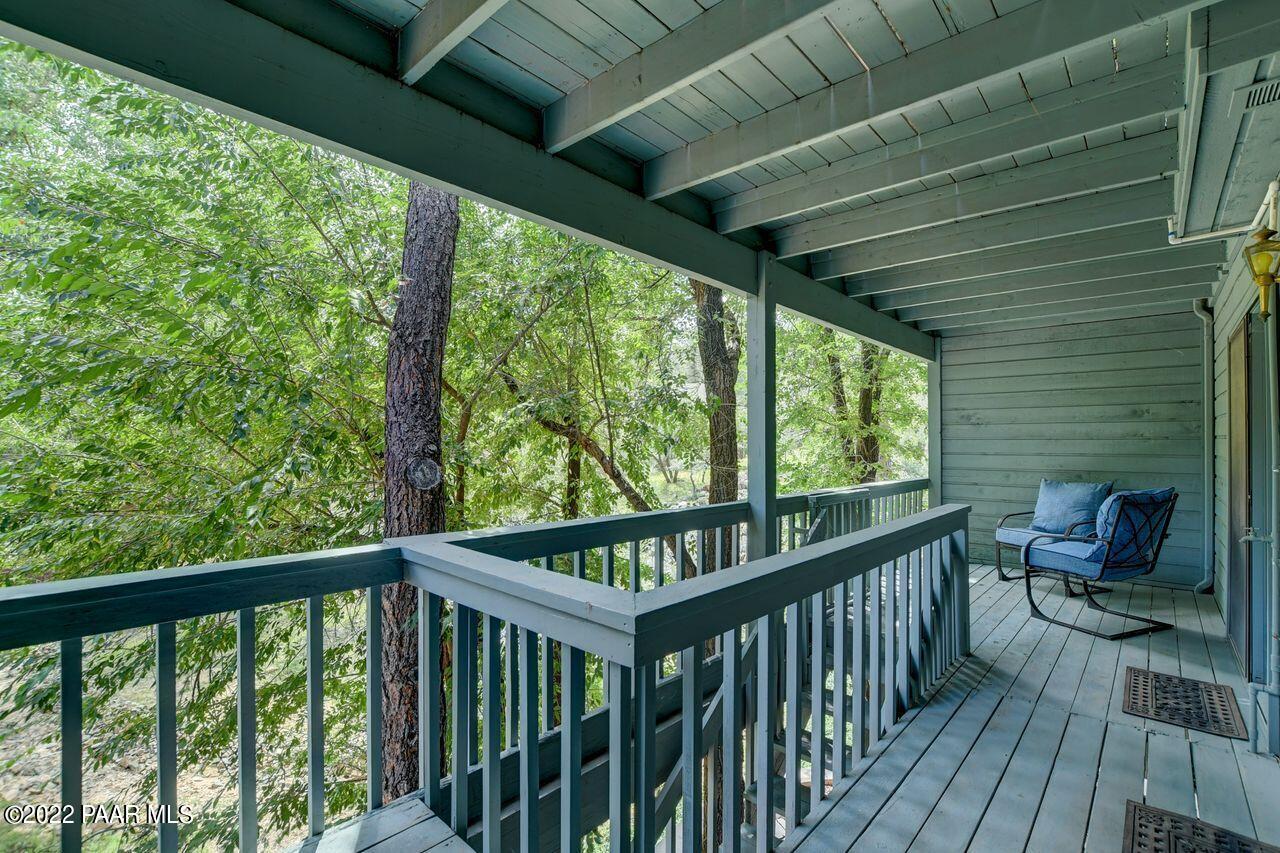 1219 Timber Point North Prescott, AZ 86303 - Photo 24 of 33 a view of a balcony with chairs and wooden fence