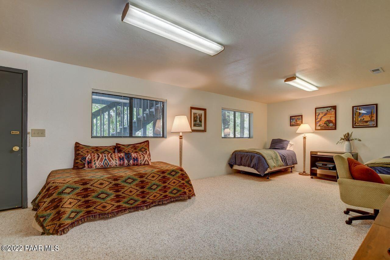 1219 Timber Point North Prescott, AZ 86303 - Photo 25 of 33 a bedroom with a bed a couch and dresser
