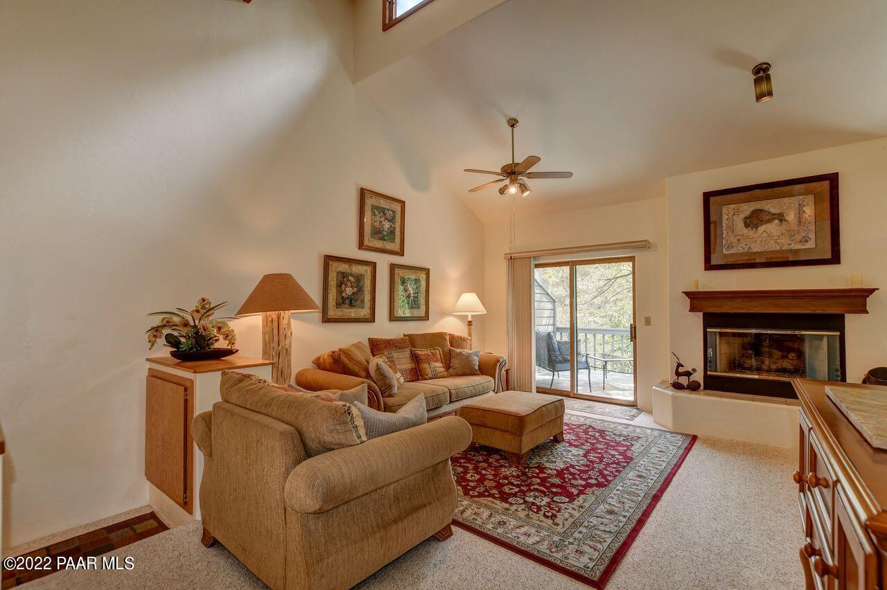 1219 Timber Point North Prescott, AZ 86303 - Photo 5 of 33 a living room with furniture a fireplace and a flat screen tv