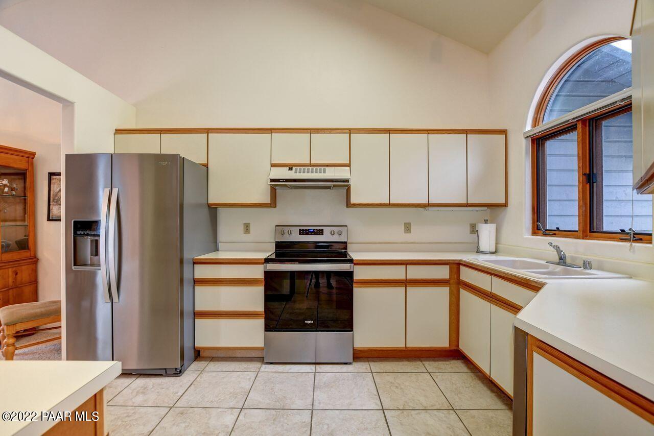 1219 Timber Point North Prescott, AZ 86303 - Photo 7 of 33 a kitchen with a stove sink and refrigerator