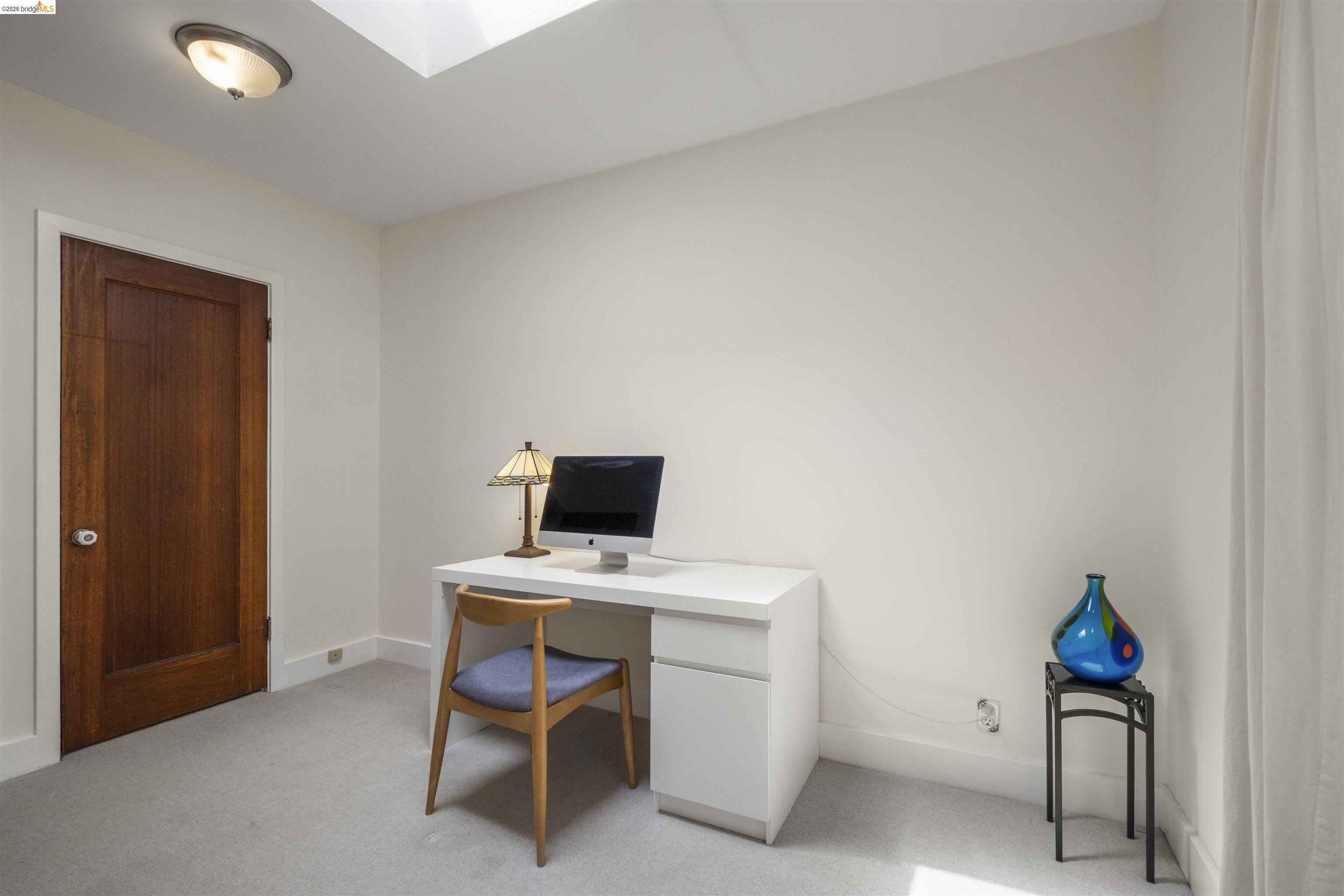 2444 Virginia Street, Unit B Berkeley, CA 94709 - Photo 32 of 39 Bright room featuring a skylight and a flush-mount ceiling light