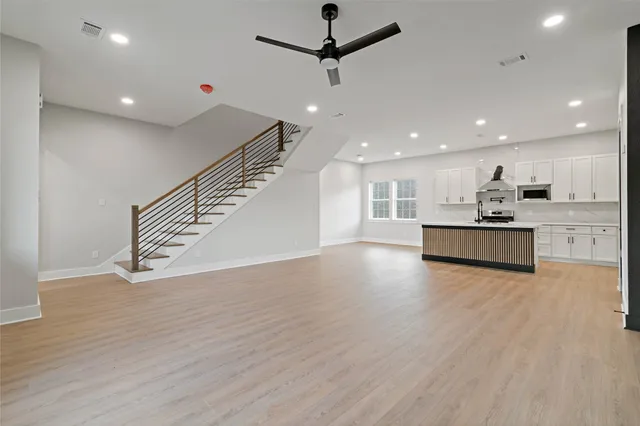 a view of kitchen with wooden floor and window