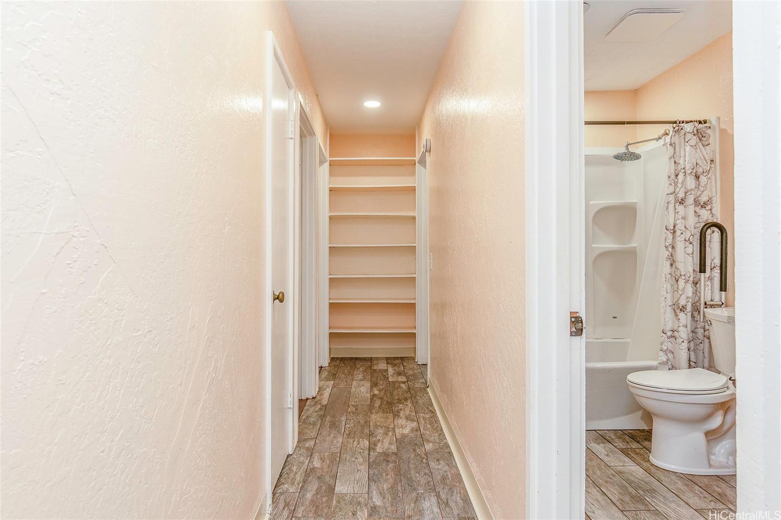 98-360 Koauka Loop, Unit 243 Aiea, HI 96701 - Photo 20 of 25 a bathroom with a sink and a toilet