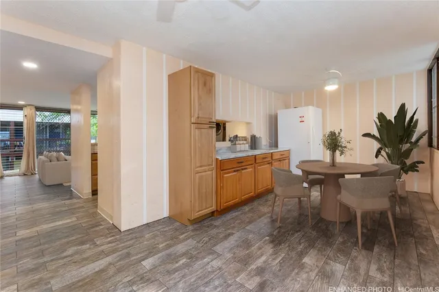 a kitchen with a table and chairs in it