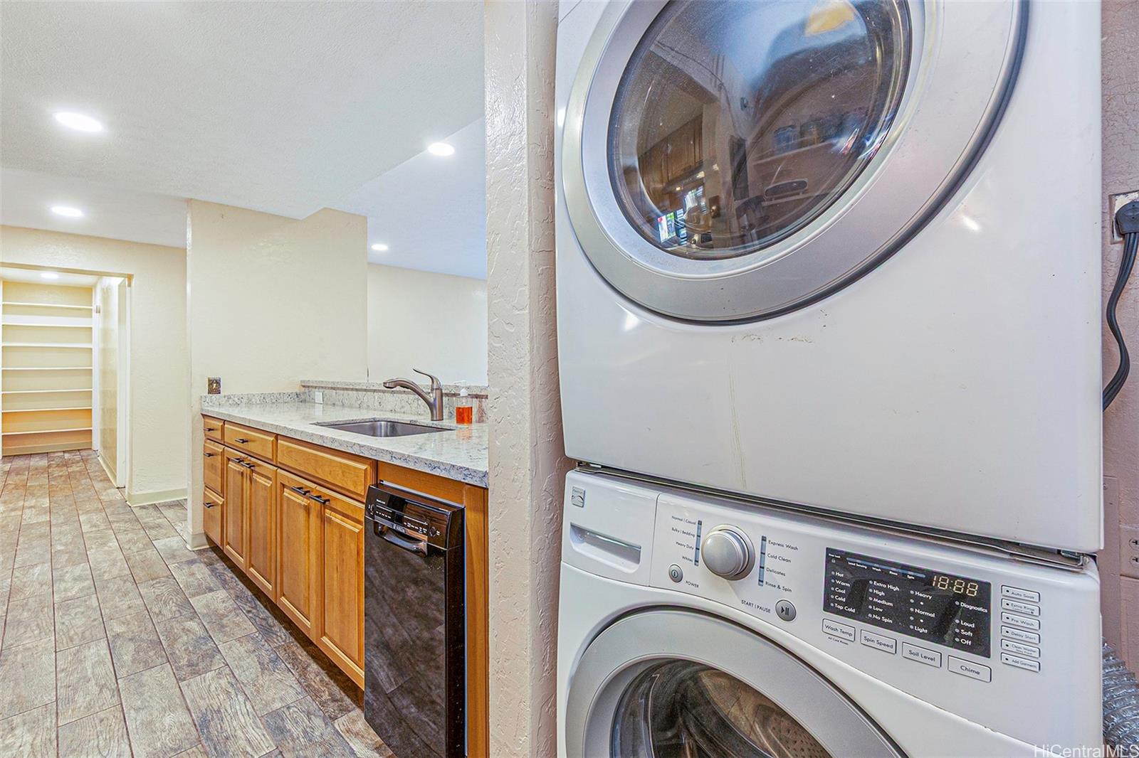98-360 Koauka Loop, Unit 243 Aiea, HI 96701 - Photo 7 of 25 a view of a kitchen with stainless steel appliances granite countertop a stove and a sink