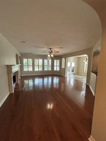 a view of an empty room with windows