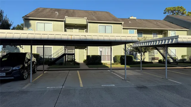 a view of a balcony with chairs